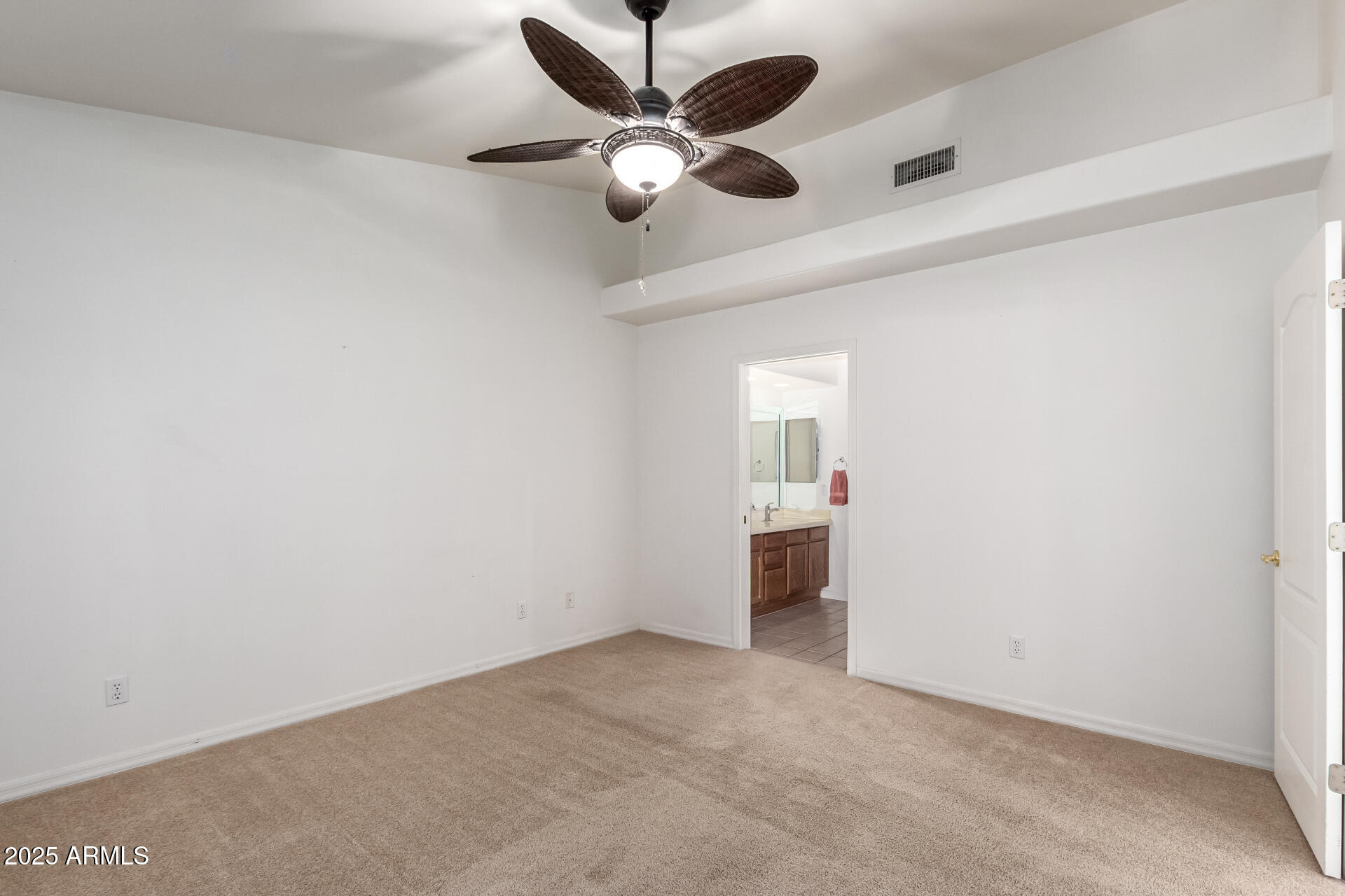 5830 East McKellips Road, Unit 100 Mesa, AZ 85215 - Photo 16 of 48 an empty room with chandelier fan and windows