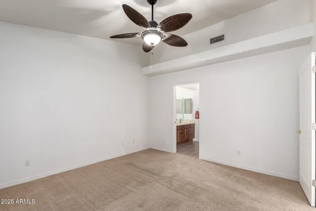a bathroom with a shower and a sink