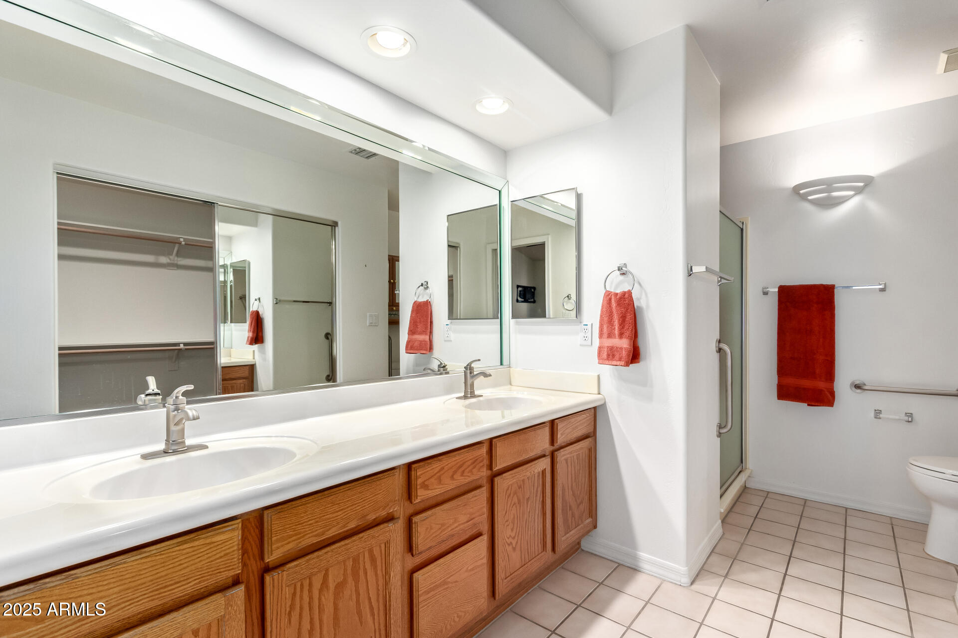 5830 East McKellips Road, Unit 100 Mesa, AZ 85215 - Photo 18 of 48 a bathroom with a double vanity sink and a mirror