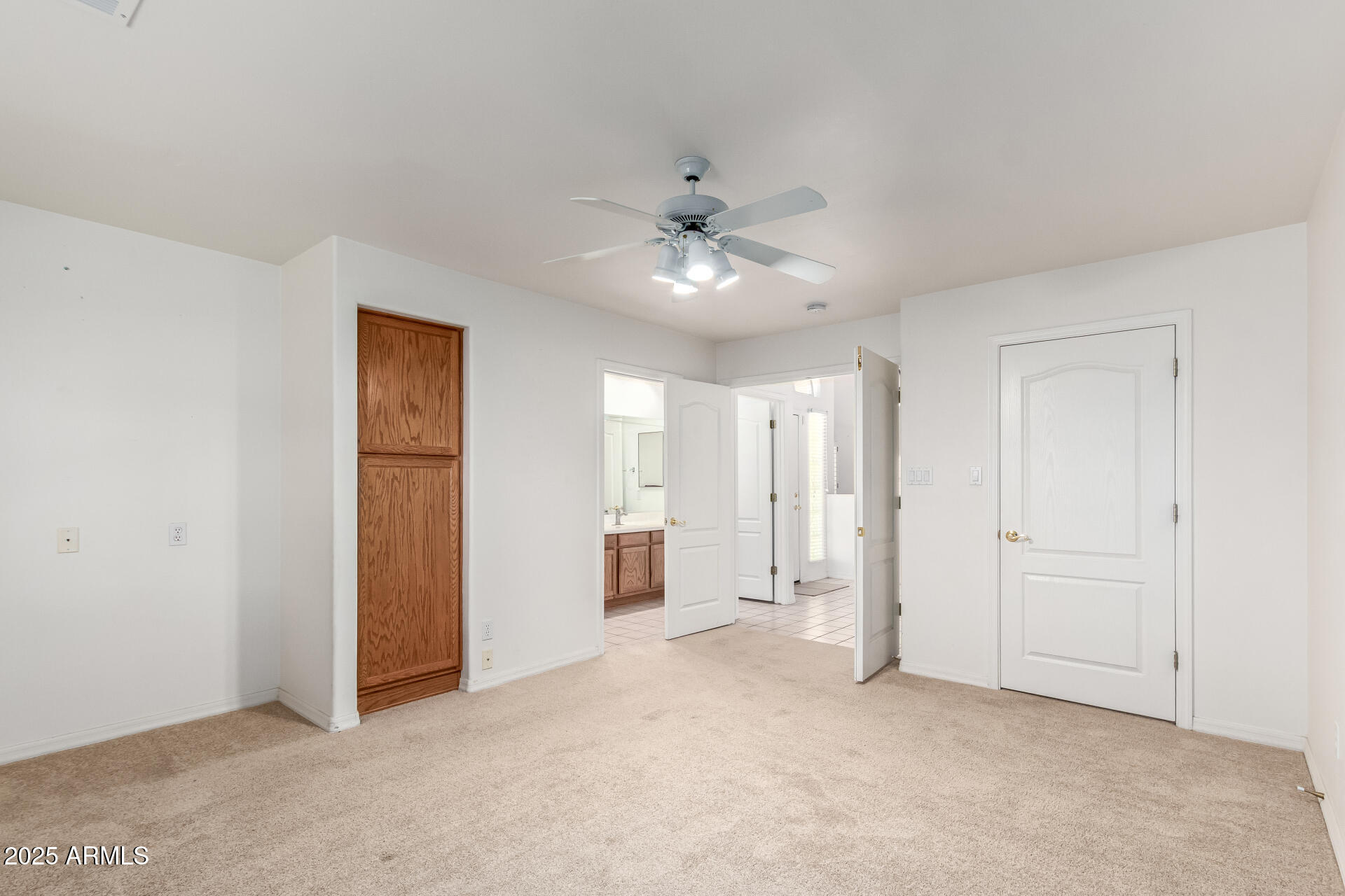 5830 East McKellips Road, Unit 100 Mesa, AZ 85215 - Photo 22 of 48 an empty room with closet and a ceiling fan