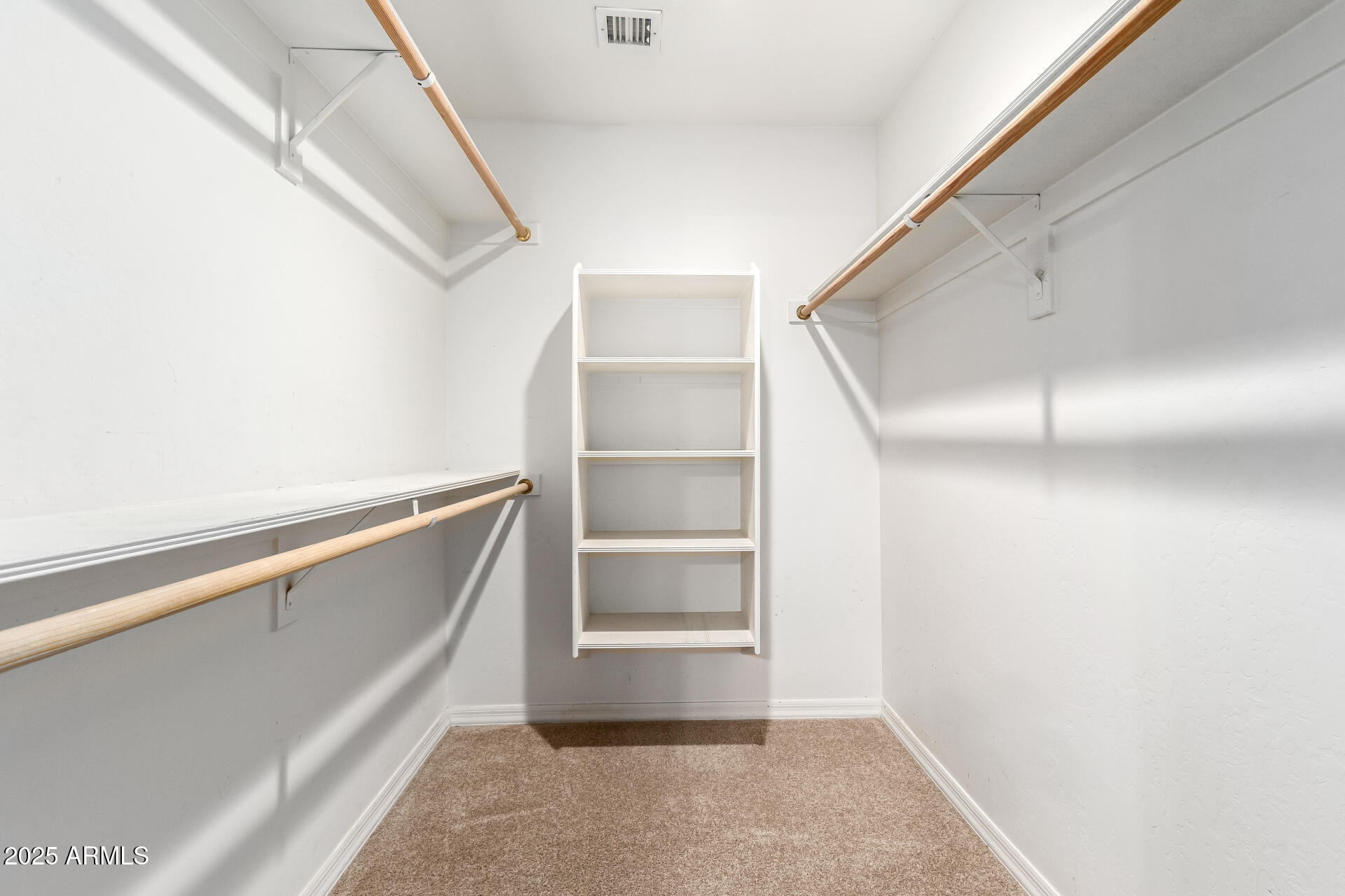 5830 East McKellips Road, Unit 100 Mesa, AZ 85215 - Photo 23 of 48 a view of an empty walk in closet
