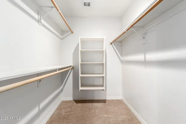 a view of storage and utility room with washer and dryer