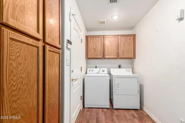 a view of a refrigerator in an empty room