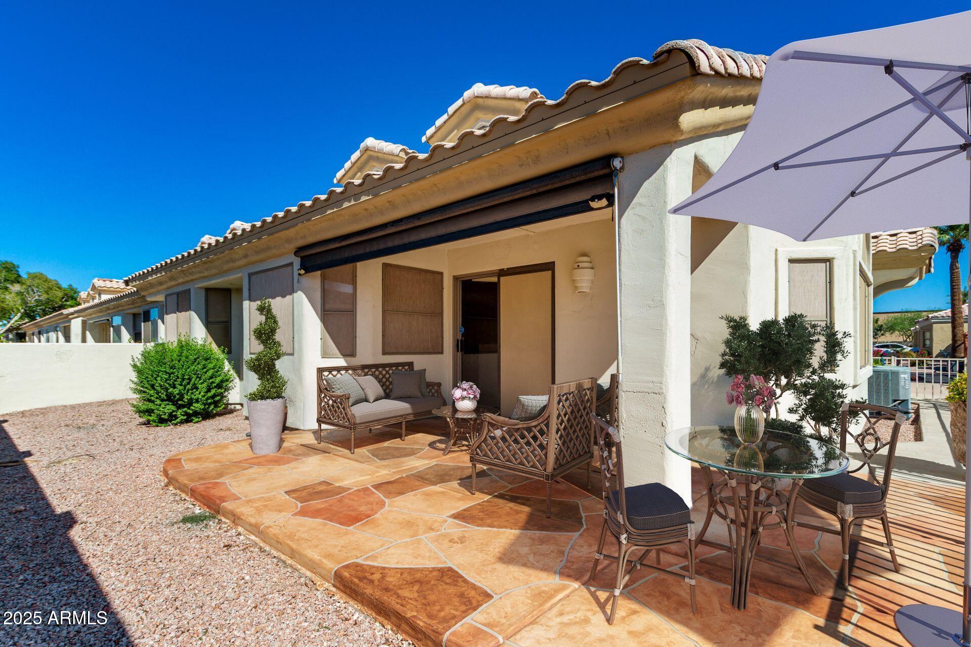 5830 East McKellips Road, Unit 100 Mesa, AZ 85215 - Photo 28 of 48 a view of a house with a patio