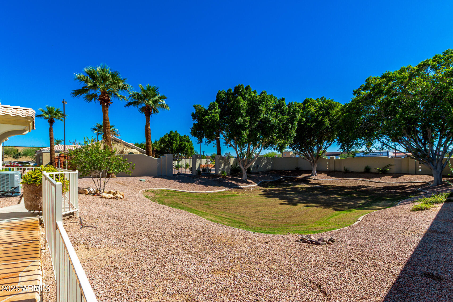 5830 East McKellips Road, Unit 100 Mesa, AZ 85215 - Photo 29 of 48 a view of a swimming pool with an outdoor space and seating area