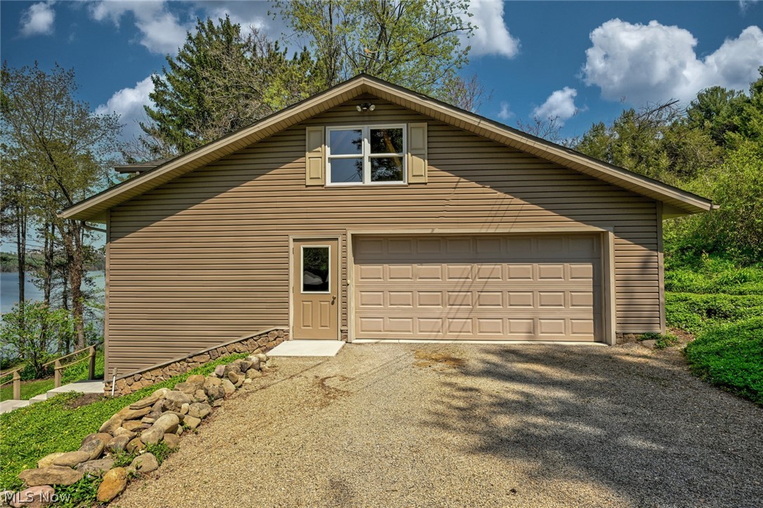2873 Lodge Road Southwest Sherrodsville, OH 44675 - Photo 44 of 50 The spacious 24x36 garage/ workshop. Plenty of space for parking as well for family & guests.