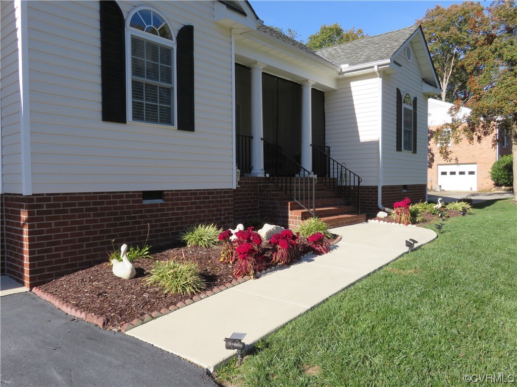 4740 Southmoor Road Richmond, VA 23234 - Photo 11 of 42 a front view of a house with a yard