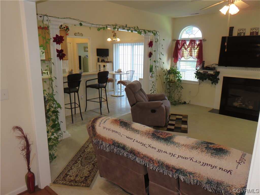 4740 Southmoor Road Richmond, VA 23234 - Photo 15 of 42 a living room with furniture and a fireplace