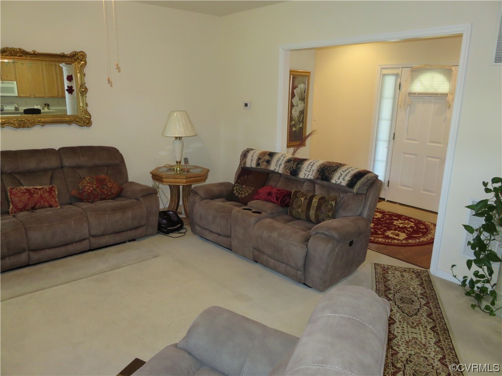 4740 Southmoor Road Richmond, VA 23234 - Photo 17 of 42 a living room with furniture and a couch