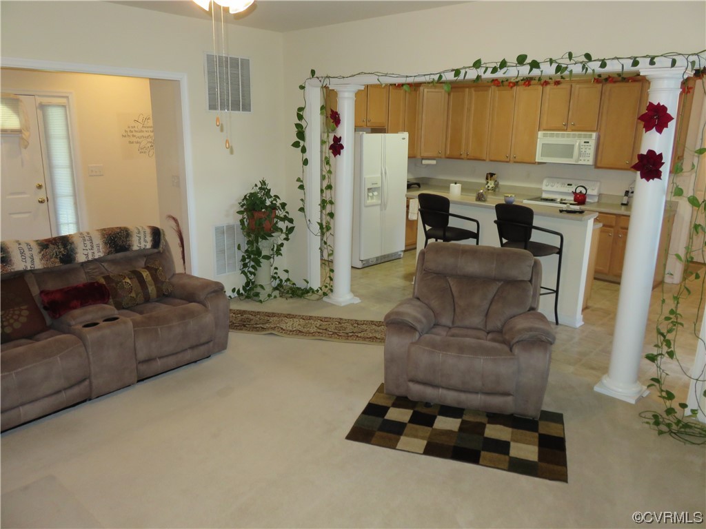 4740 Southmoor Road Richmond, VA 23234 - Photo 18 of 42 a living room with furniture and a flat screen tv