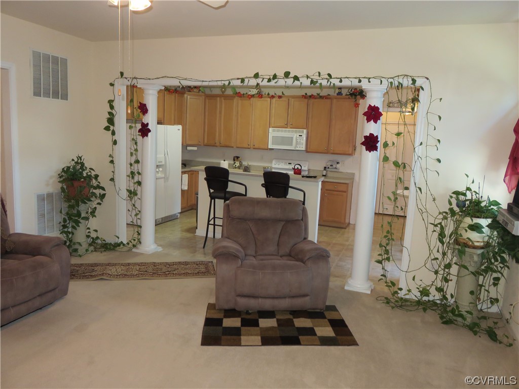4740 Southmoor Road Richmond, VA 23234 - Photo 19 of 42 a living room with furniture and a fireplace