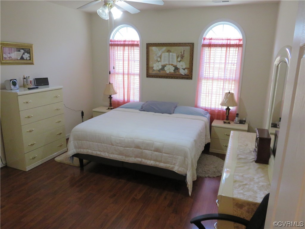 4740 Southmoor Road Richmond, VA 23234 - Photo 25 of 42 a bedroom with a bed and a chandelier