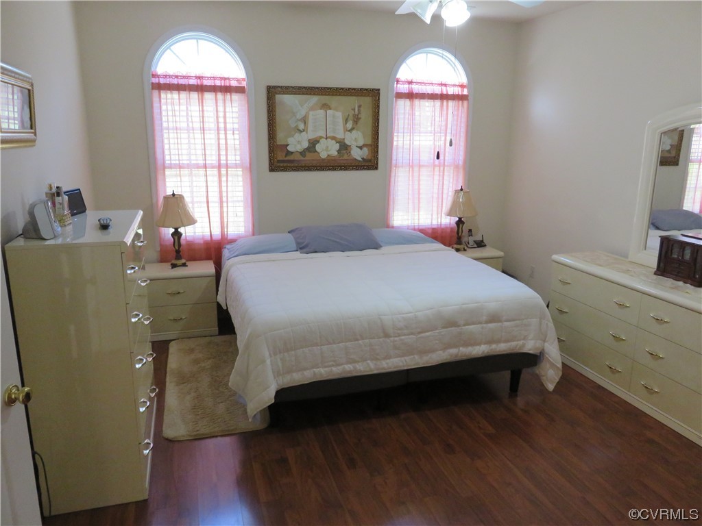 4740 Southmoor Road Richmond, VA 23234 - Photo 26 of 42 a bedroom with a bed and a chandelier