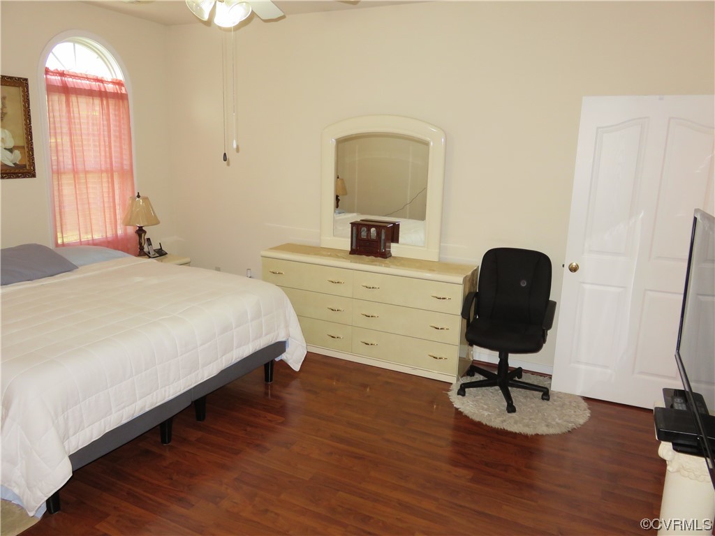 4740 Southmoor Road Richmond, VA 23234 - Photo 27 of 42 a bedroom with a bed a desk and chair