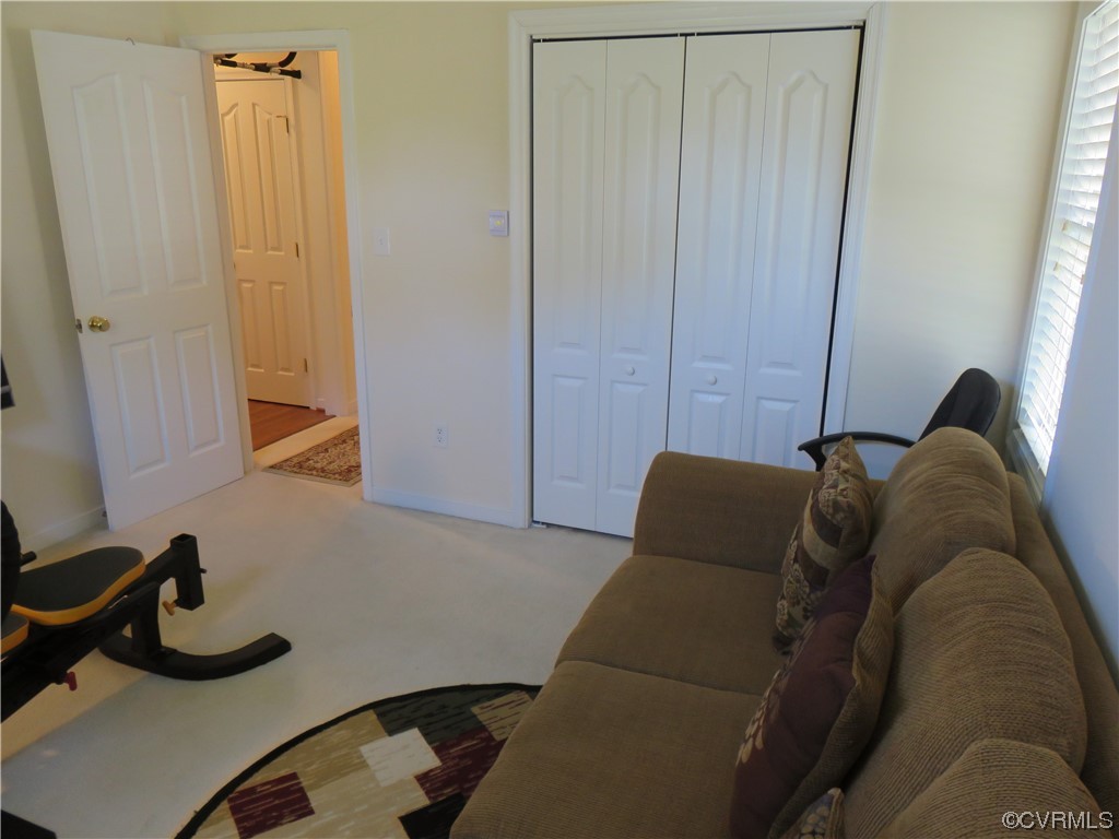 4740 Southmoor Road Richmond, VA 23234 - Photo 37 of 42 a living room with furniture and a window