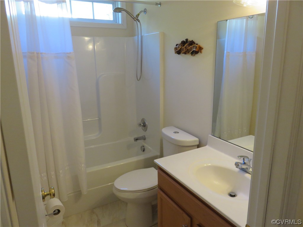 4740 Southmoor Road Richmond, VA 23234 - Photo 39 of 42 a bathroom with a sink toilet and shower
