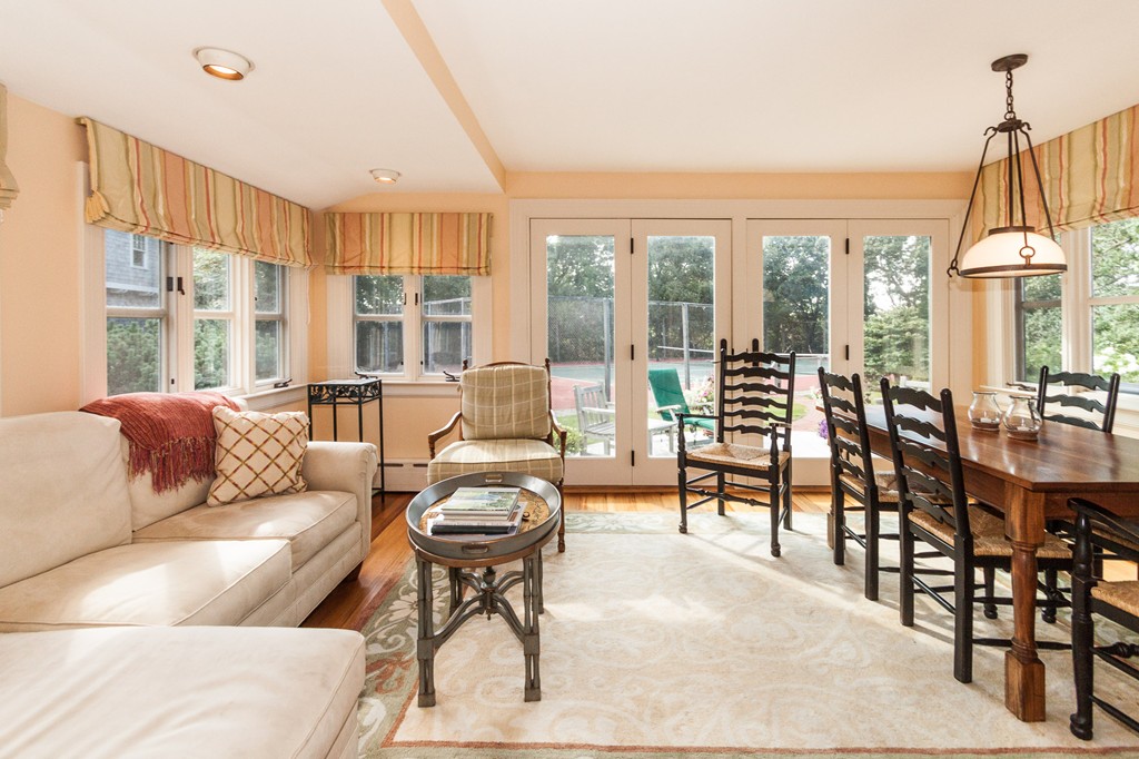 100 Nichols Road Cohasset, MA 02025 - Photo 20 of 30 a living room with furniture and a floor to ceiling window