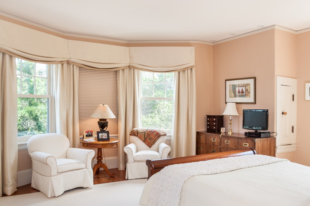 100 Nichols Road Cohasset, MA 02025 - Photo 24 of 30 a bedroom with furniture a large bed and a flat screen tv