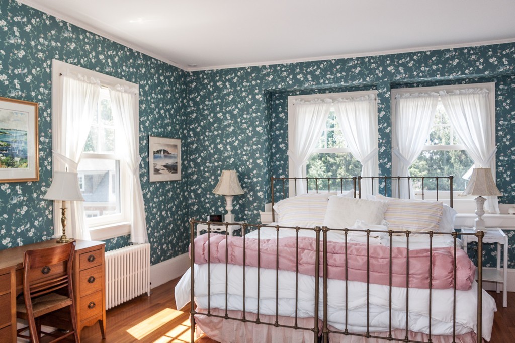 100 Nichols Road Cohasset, MA 02025 - Photo 26 of 30 a bed sitting in a bedroom next to a window