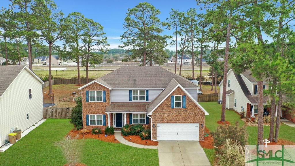 115 Saratoga Drive Rincon, GA 31326 - Photo 2 of 50 Grass is enhanced for picture