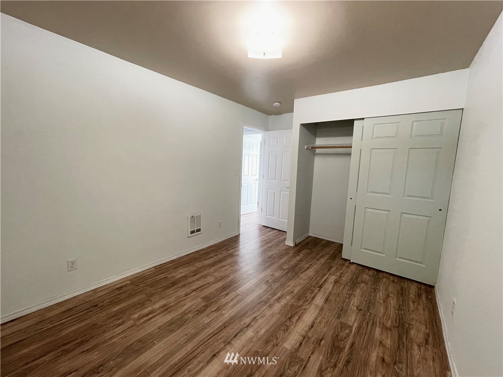 2804 Northeast 7th Street Renton, WA 98056 - Photo 14 of 29 wooden floor in an empty room