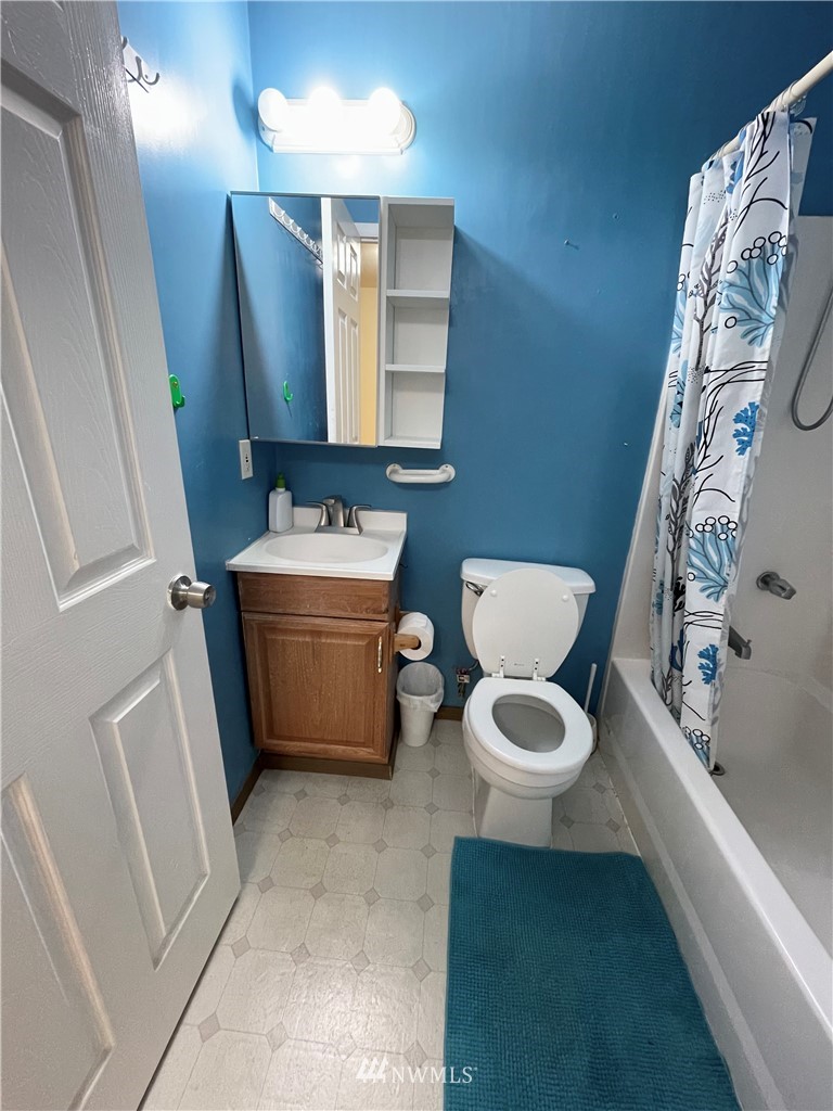 2804 Northeast 7th Street Renton, WA 98056 - Photo 22 of 29 a bathroom with a toilet sink and mirror