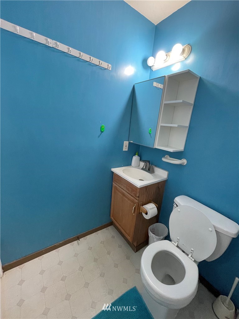 2804 Northeast 7th Street Renton, WA 98056 - Photo 23 of 29 a bathroom with a toilet sink and mirror