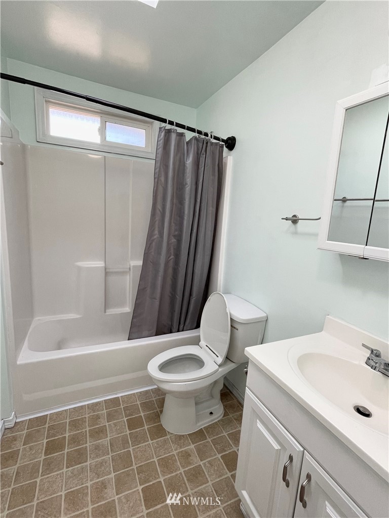 2804 Northeast 7th Street Renton, WA 98056 - Photo 9 of 29 a bathroom with a sink toilet and shower