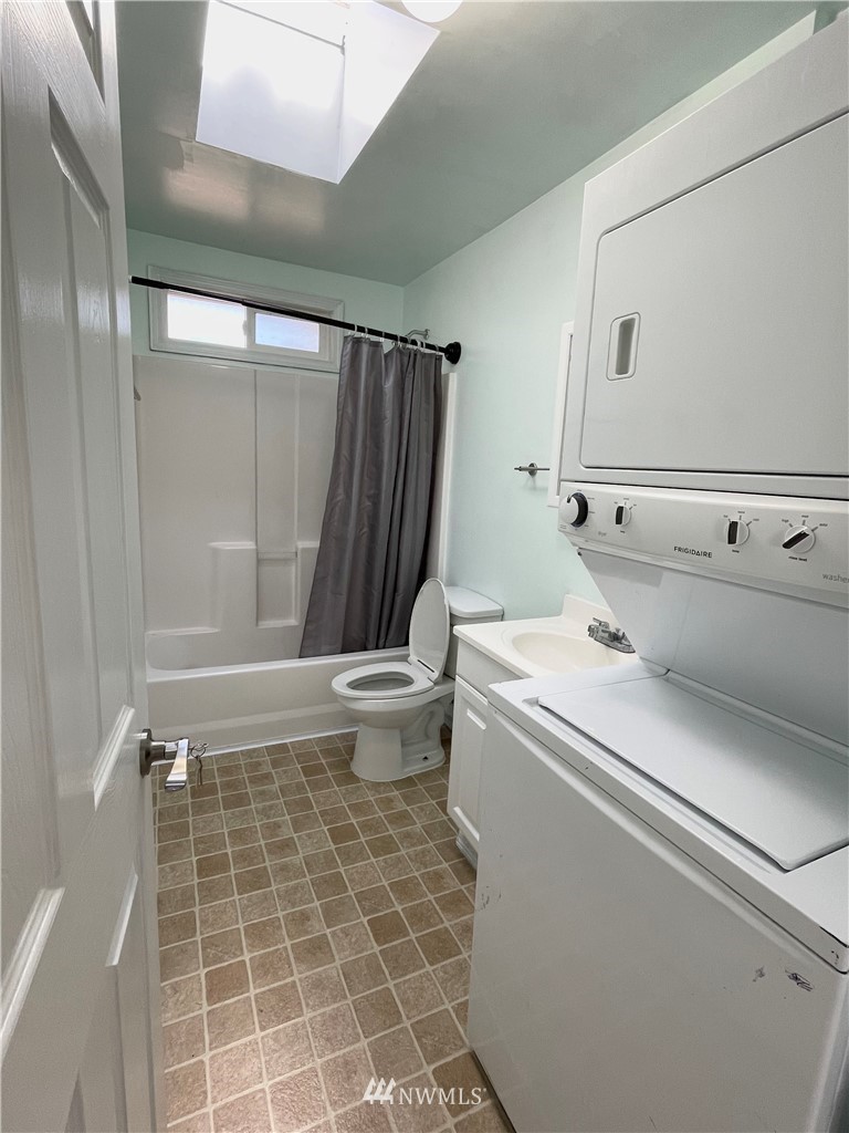2804 Northeast 7th Street Renton, WA 98056 - Photo 10 of 29 a bathroom with a sink toilet and shower
