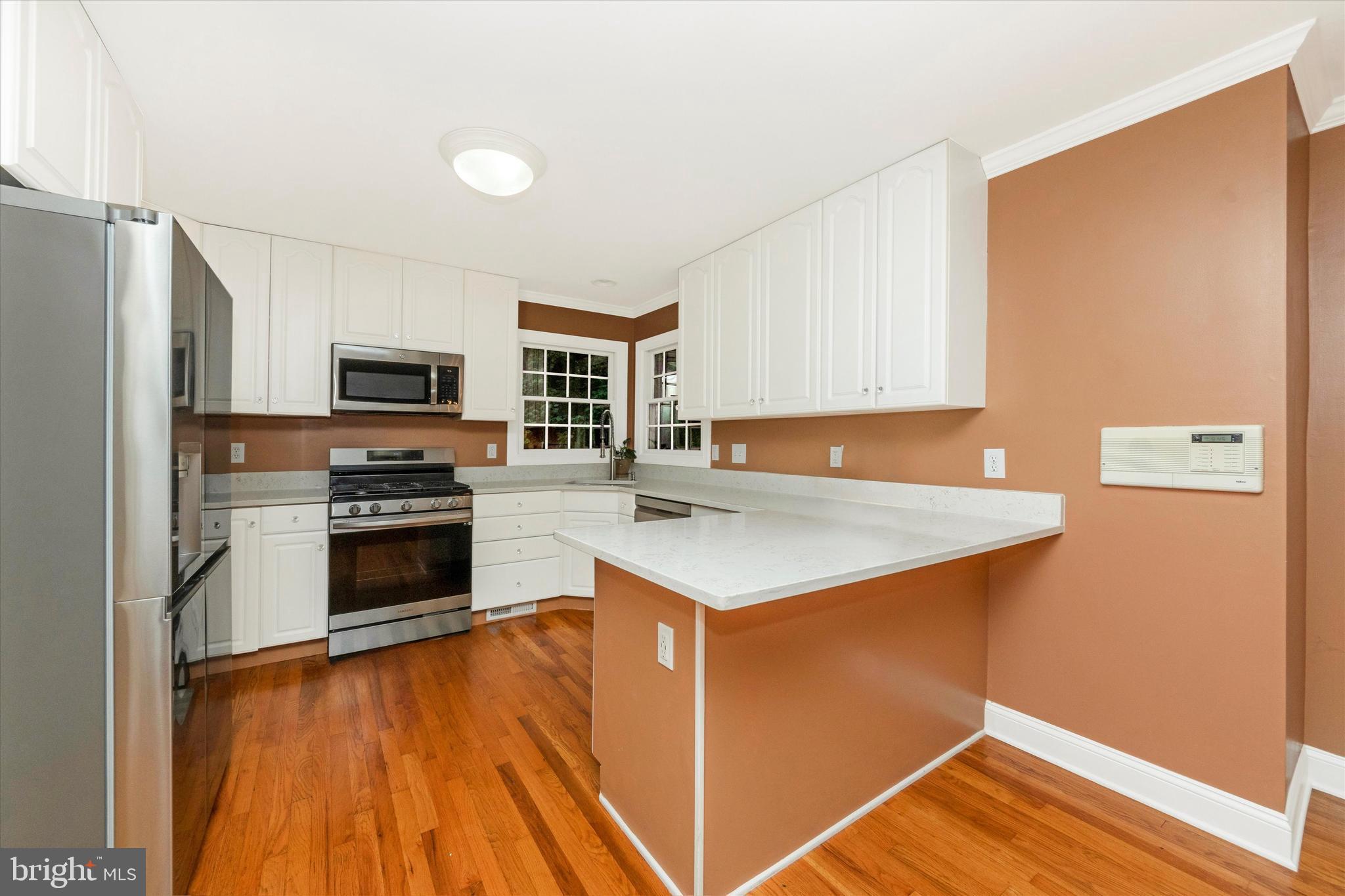 2668 Ogleton Road Annapolis, MD 21403 - Photo 11 of 51 a kitchen with a sink stove and refrigerator