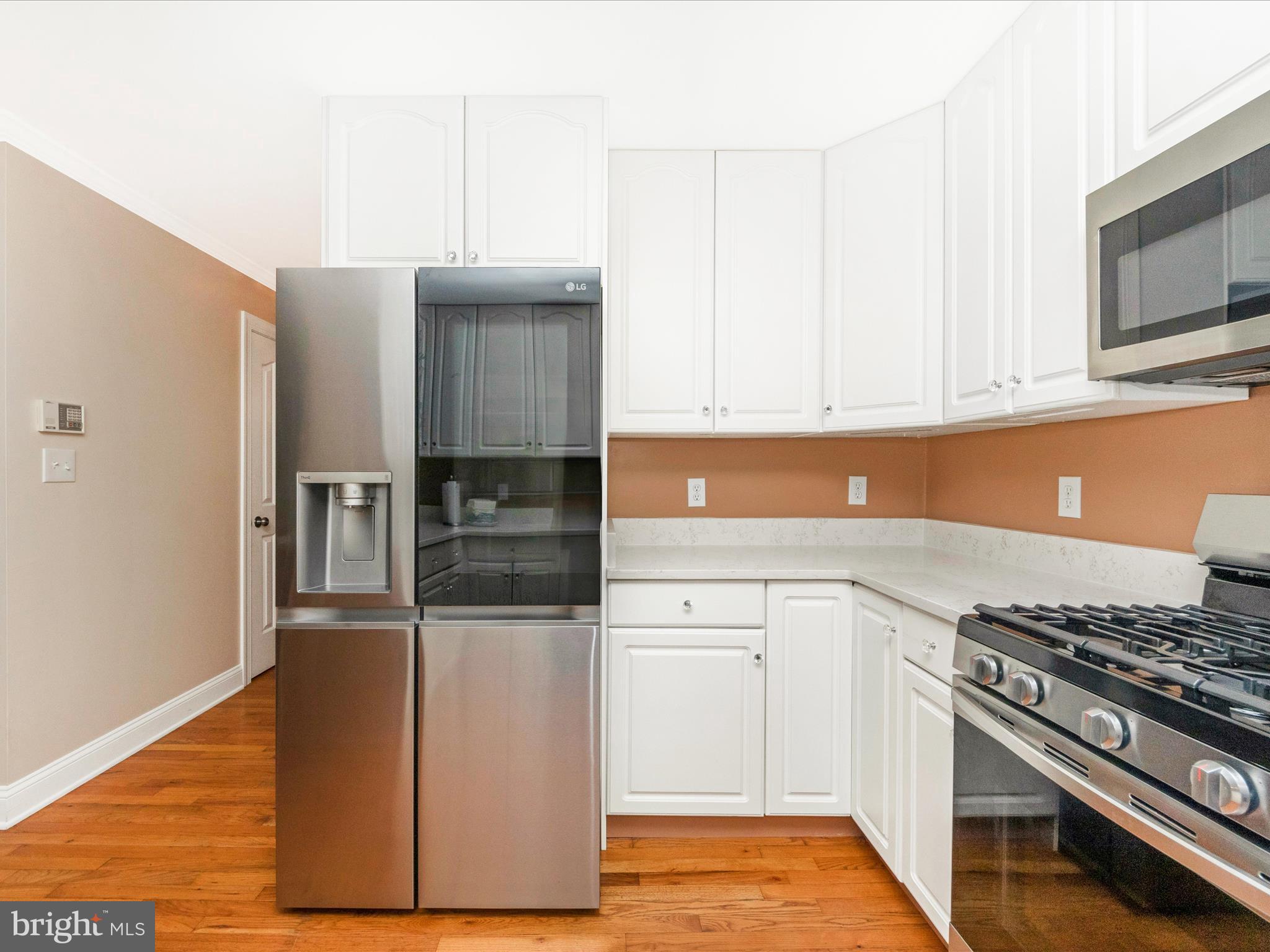 2668 Ogleton Road Annapolis, MD 21403 - Photo 12 of 51 a kitchen with stainless steel appliances granite countertop a stove and a refrigerator