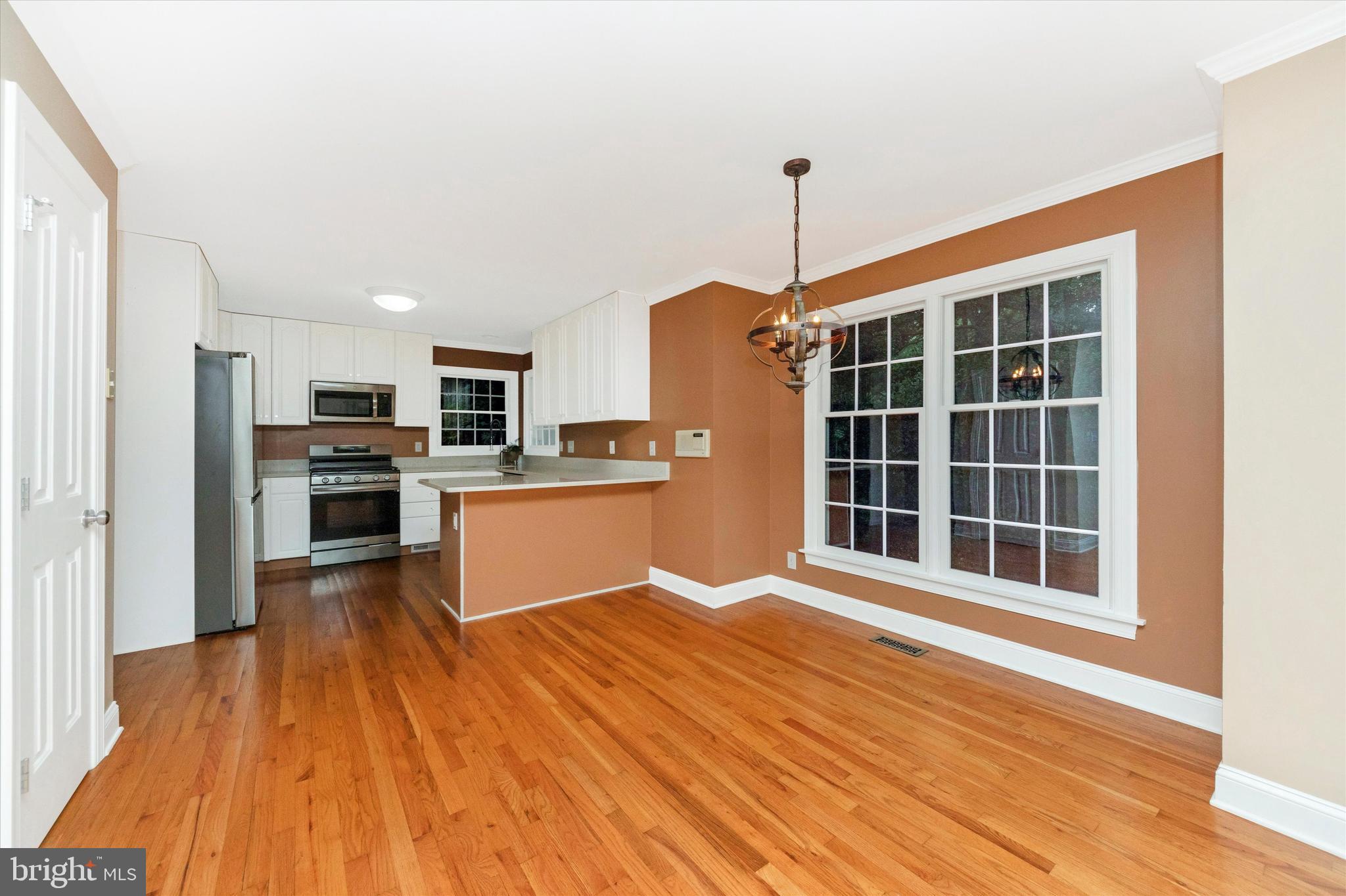2668 Ogleton Road Annapolis, MD 21403 - Photo 14 of 51 a view of large kitchen with wooden floor and stainless steel appliances