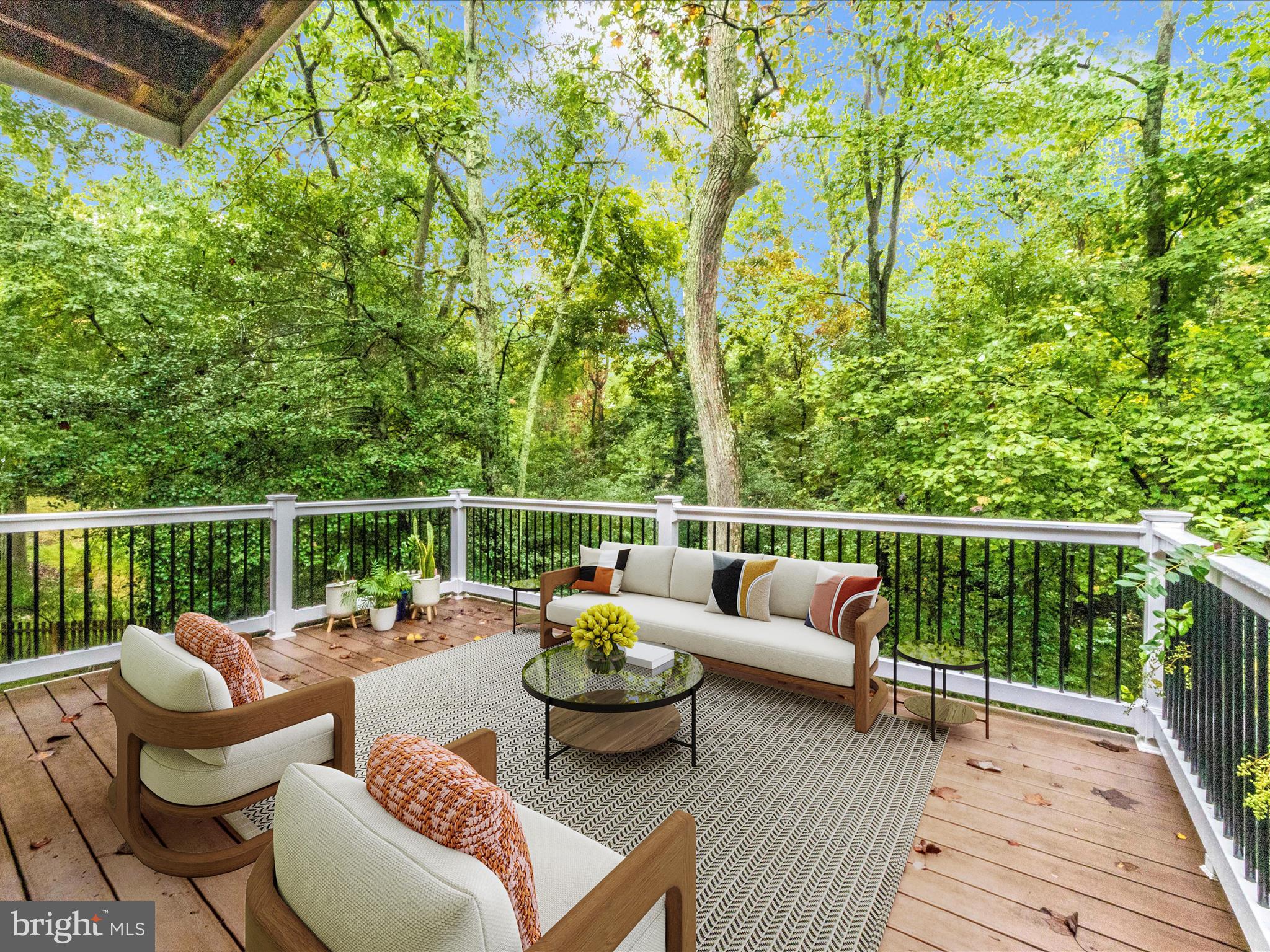 2668 Ogleton Road Annapolis, MD 21403 - Photo 18 of 51 a view of a patio with couches chairs and wooden floor