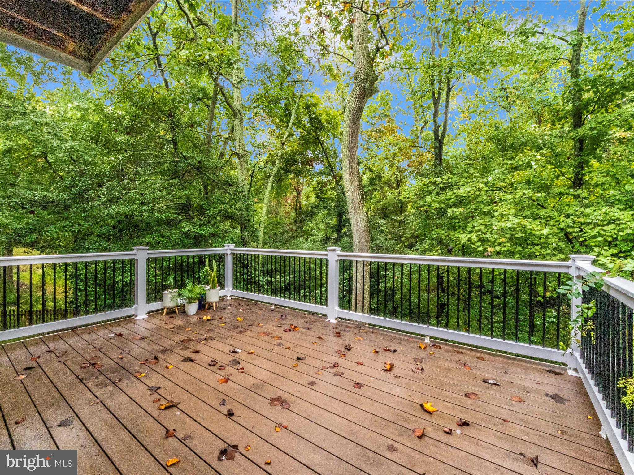 2668 Ogleton Road Annapolis, MD 21403 - Photo 19 of 51 a balcony with wooden floor and fence