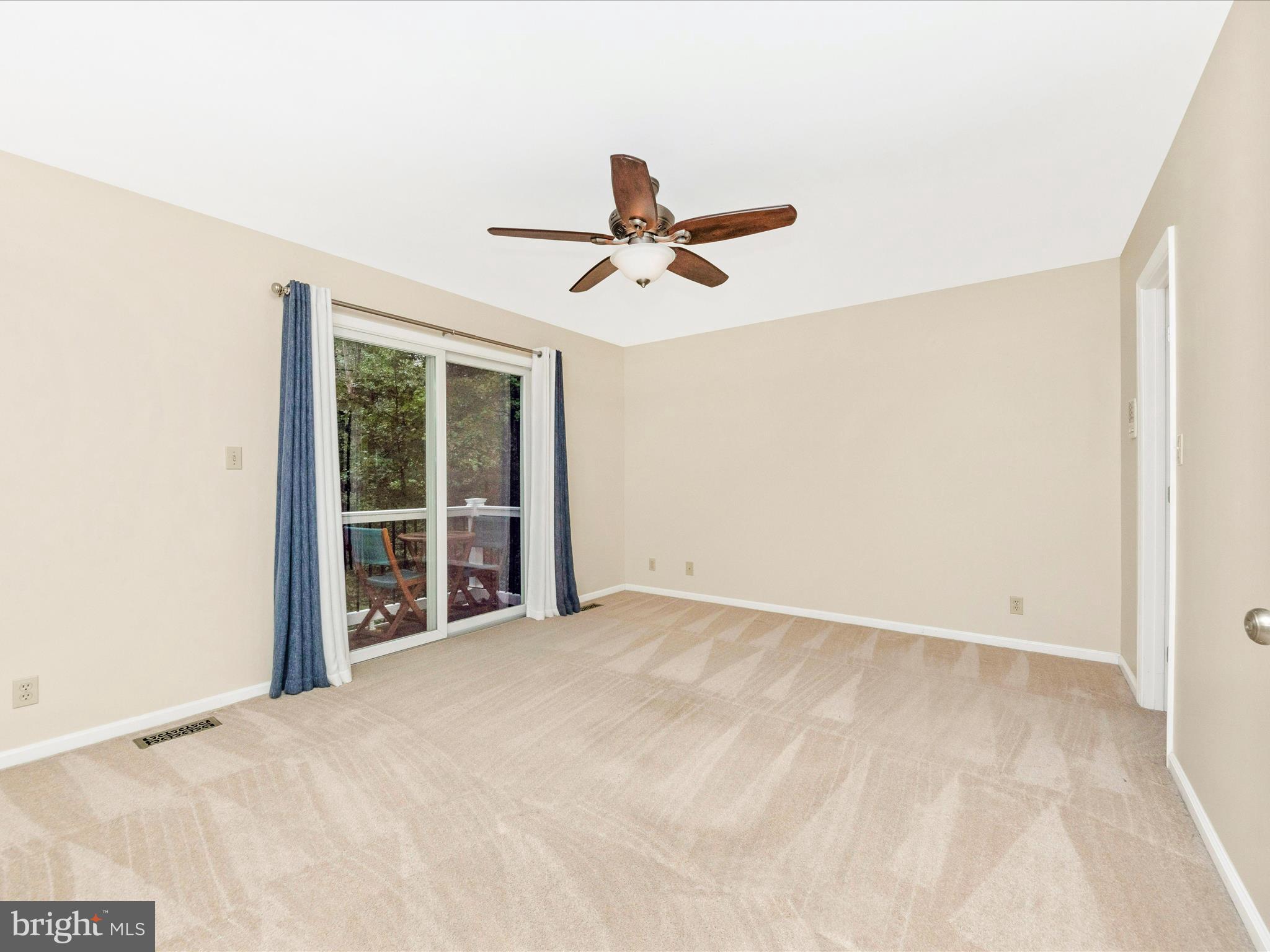 2668 Ogleton Road Annapolis, MD 21403 - Photo 22 of 51 an empty room with windows and fan