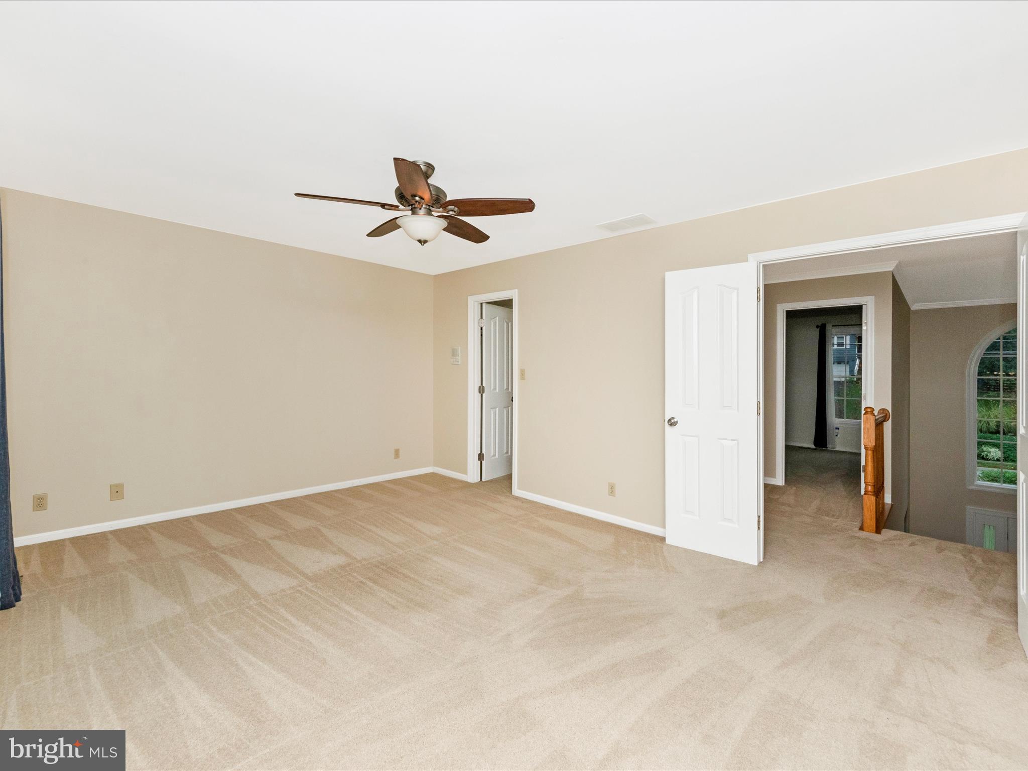 2668 Ogleton Road Annapolis, MD 21403 - Photo 24 of 51 an empty room with closet and a ceiling fan