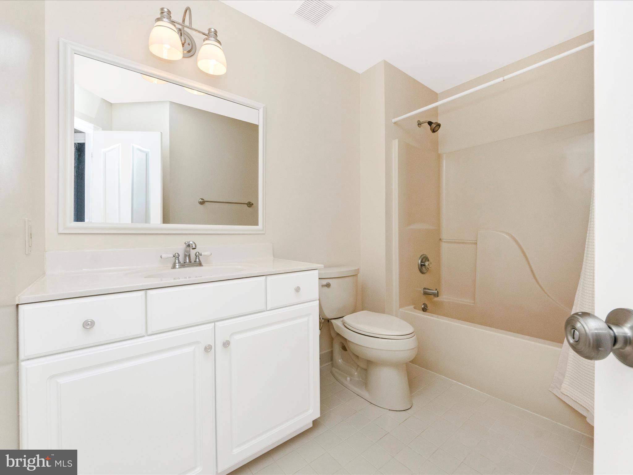 2668 Ogleton Road Annapolis, MD 21403 - Photo 31 of 51 a bathroom with a sink a toilet and shower