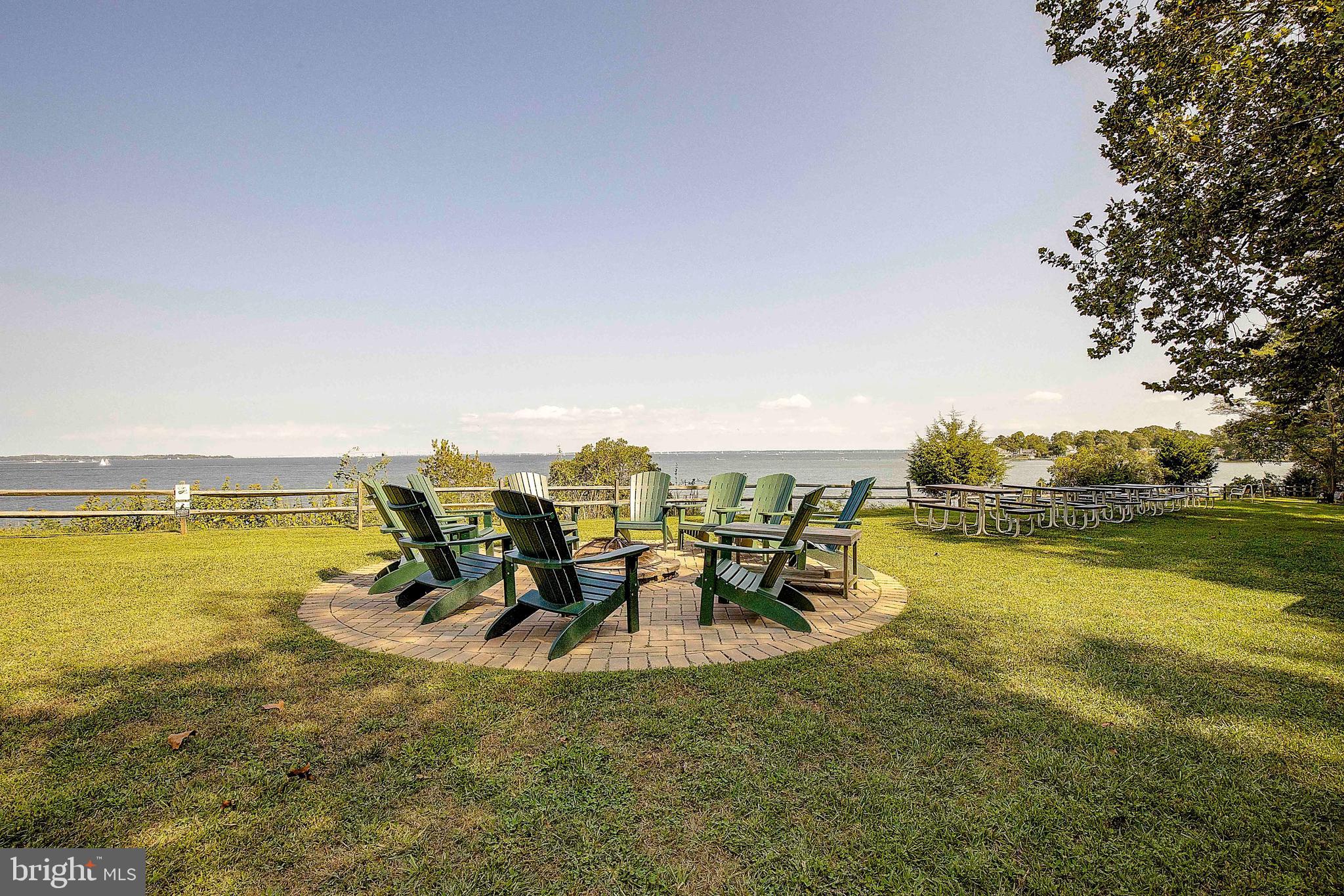 2668 Ogleton Road Annapolis, MD 21403 - Photo 43 of 51 a view of a lake with a table and chairs