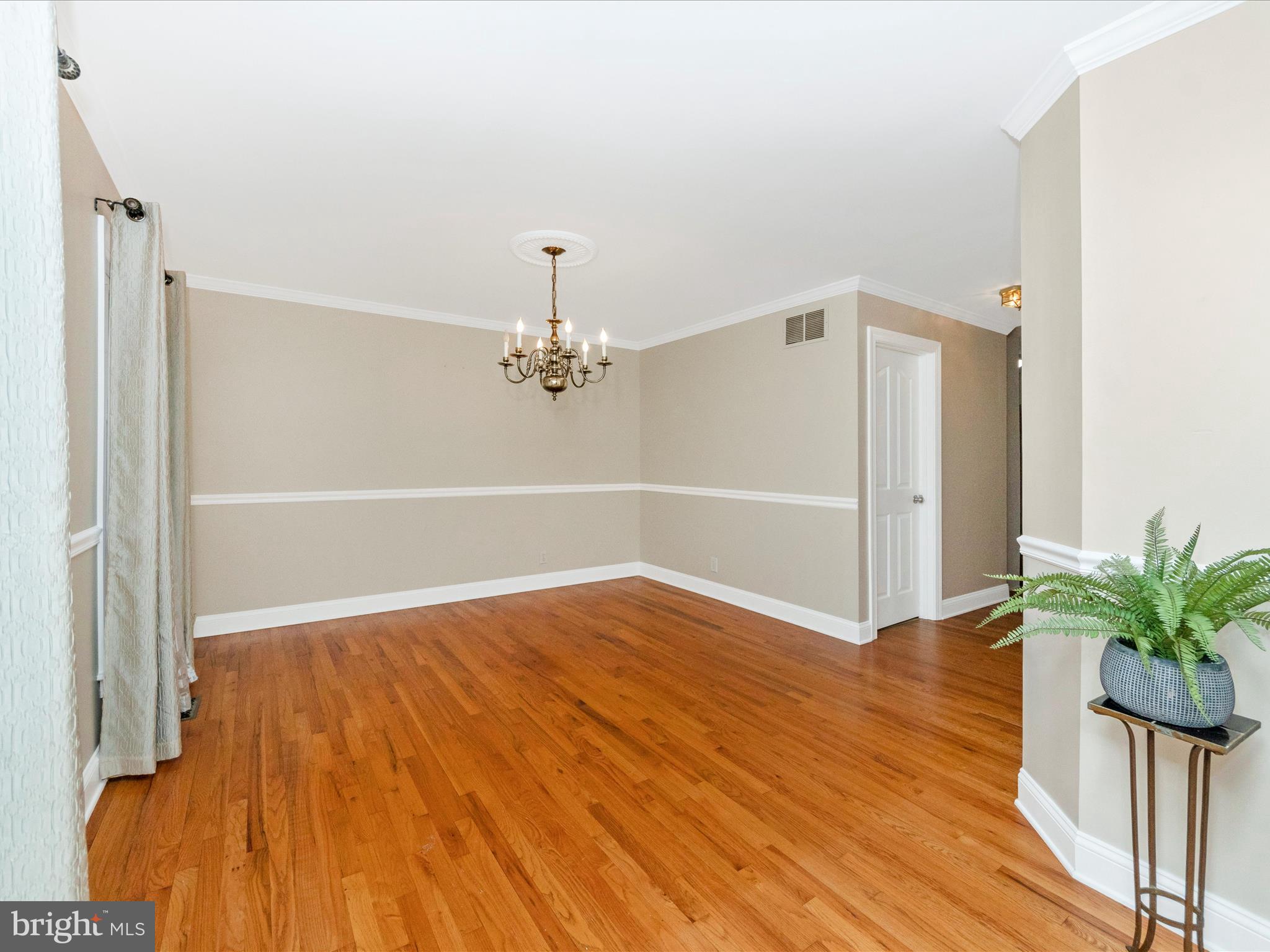 2668 Ogleton Road Annapolis, MD 21403 - Photo 8 of 51 a view of empty room with wooden floor and fan