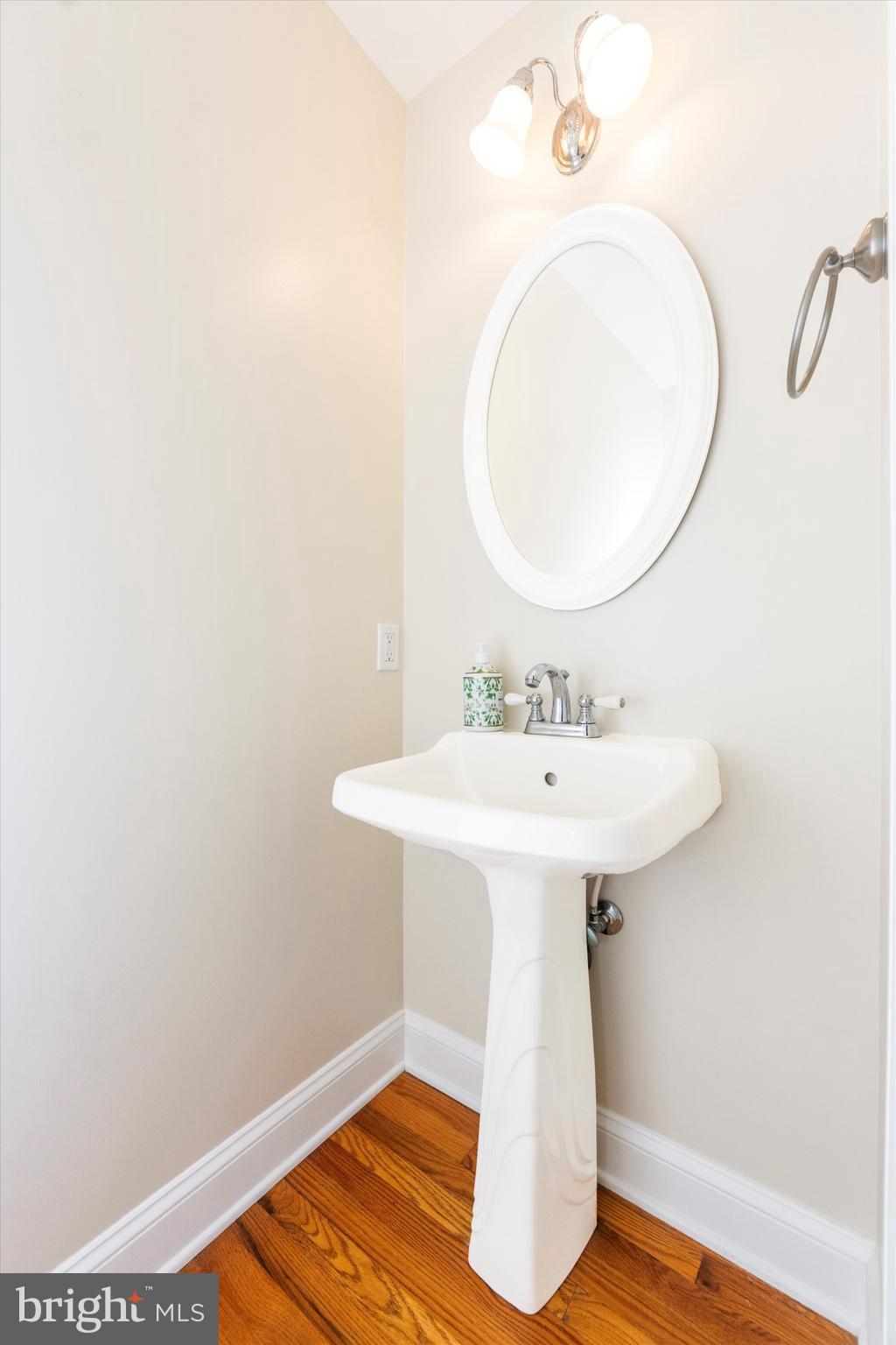 2668 Ogleton Road Annapolis, MD 21403 - Photo 9 of 51 a bathroom with a sink a mirror and a toilet