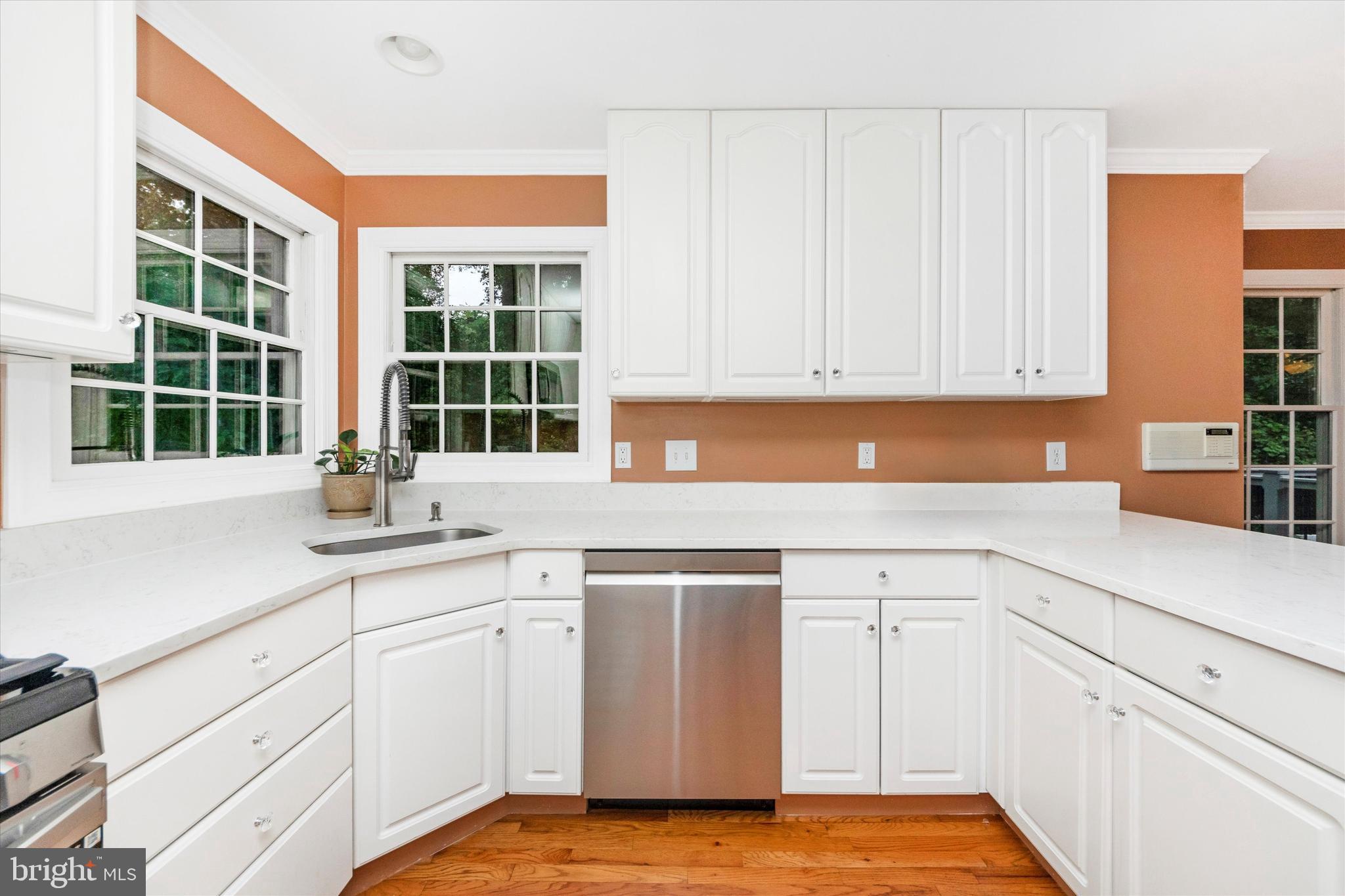 2668 Ogleton Road Annapolis, MD 21403 - Photo 10 of 51 a kitchen with granite countertop white cabinets and sink