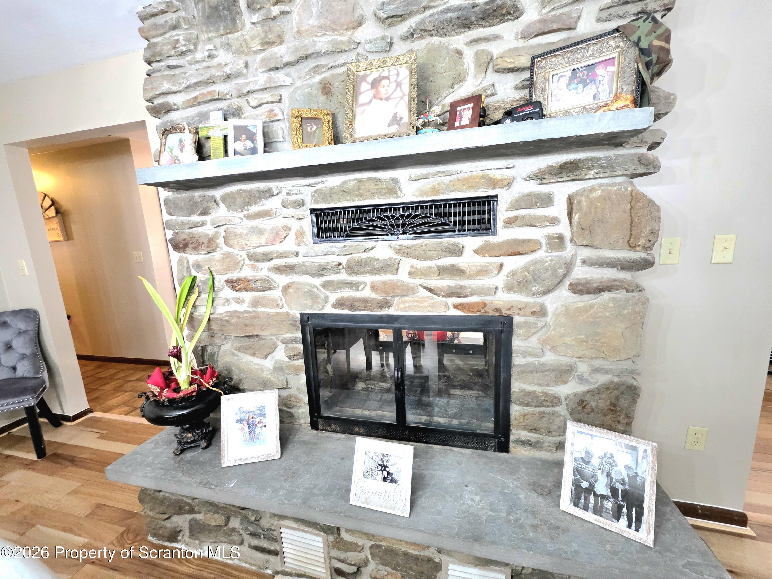 906 Violet Terrace Clarks Summit, PA 18411 - Photo 13 of 39 Dining Room Fireplace