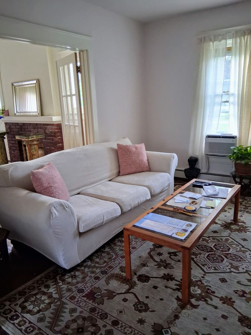 742 South 4th Street DeKalb, IL 60115 - Photo 11 of 46 a living room with furniture and a window