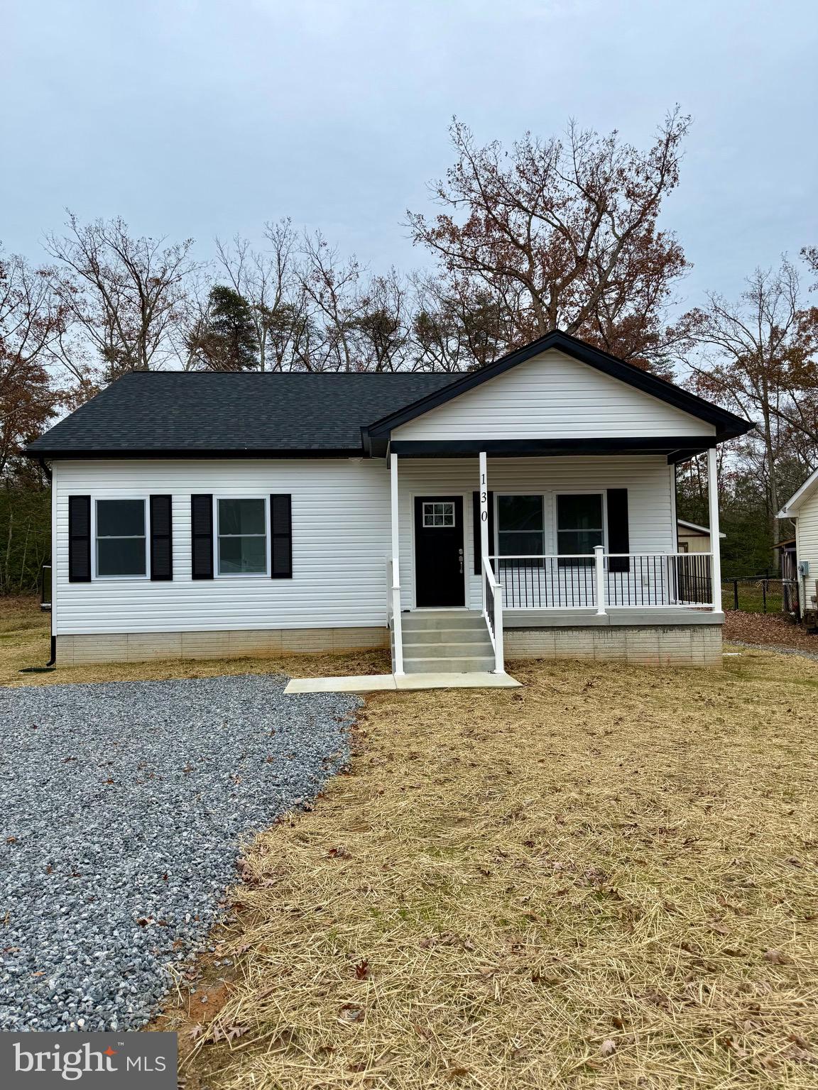 130 Poplar Lane Colonial Beach, VA 22443 - Photo 2 of 74 a front view of a house with a yard