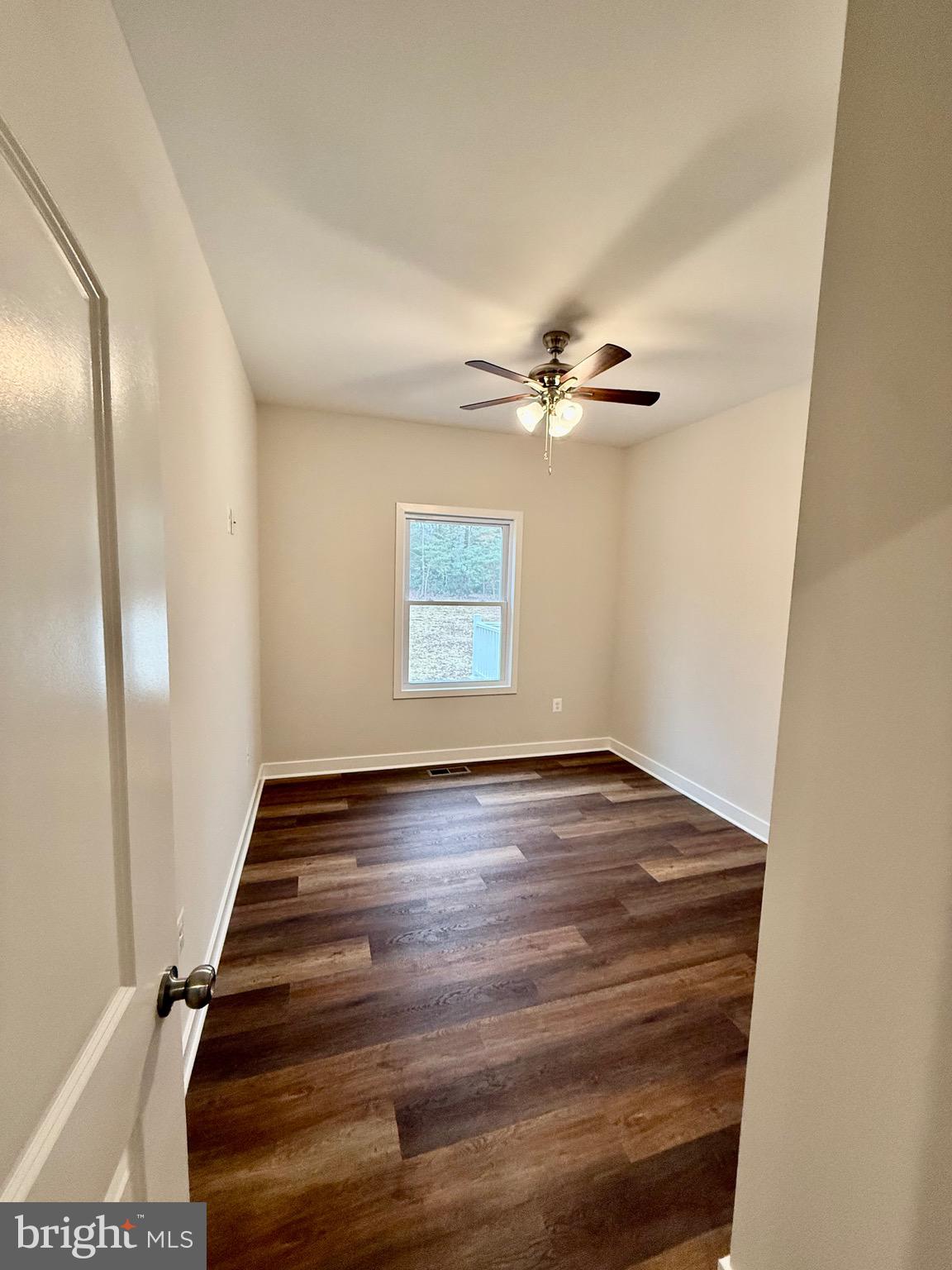 130 Poplar Lane Colonial Beach, VA 22443 - Photo 33 of 74 a view of an empty room with a window