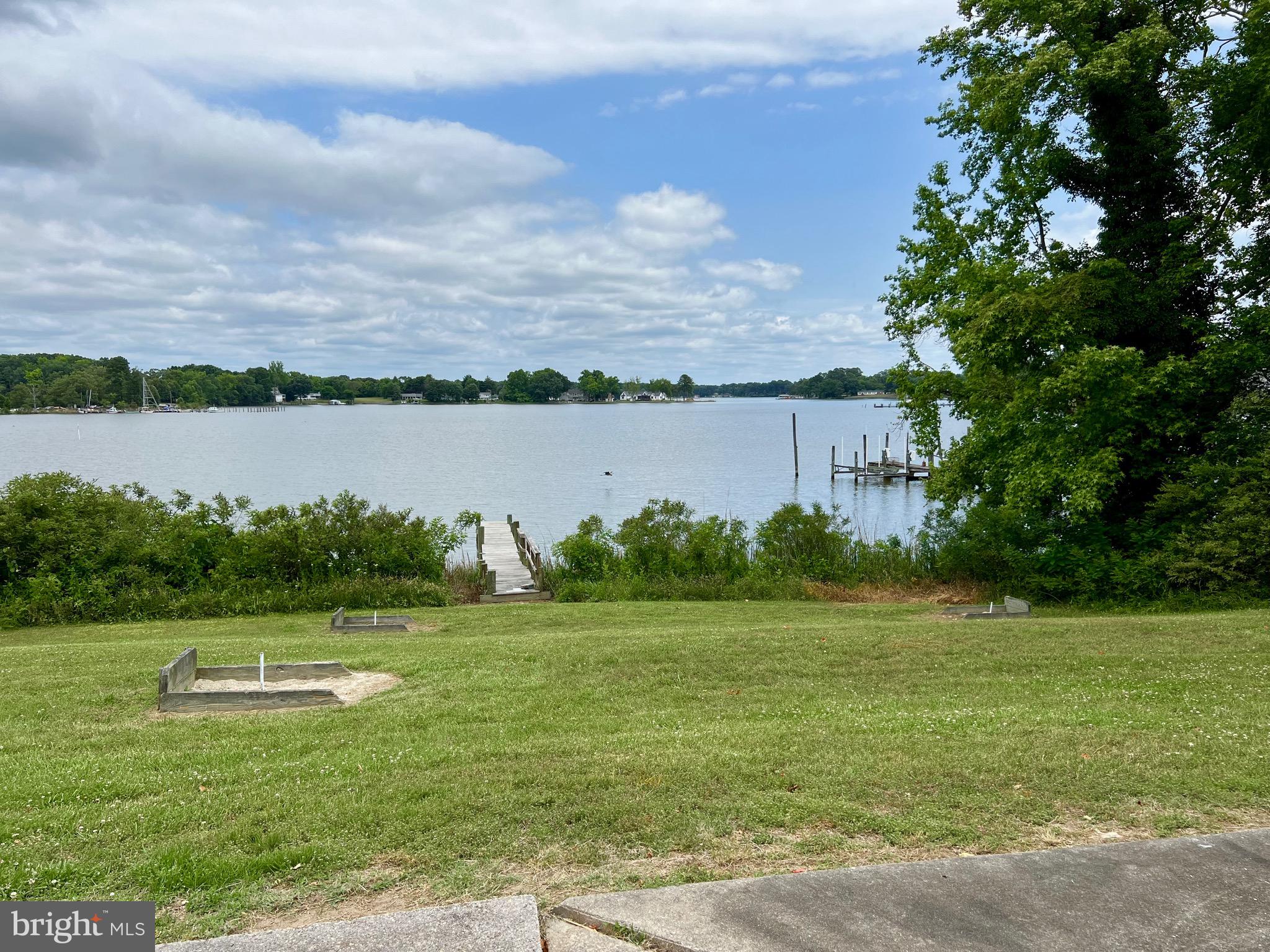 130 Poplar Lane Colonial Beach, VA 22443 - Photo 51 of 74 a view of a lake with a big yard and large trees