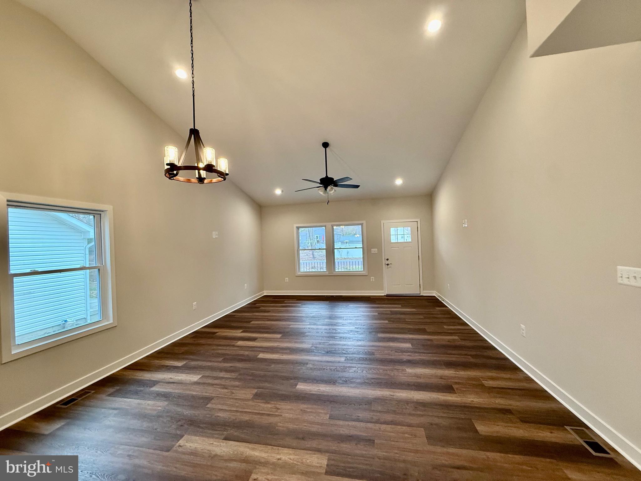 130 Poplar Lane Colonial Beach, VA 22443 - Photo 9 of 74 a view of an empty room with window and wooden floor