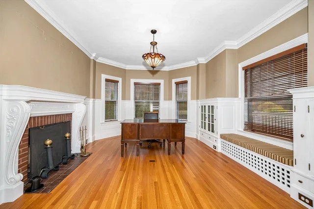 a view of a livingroom with furniture and a fireplace