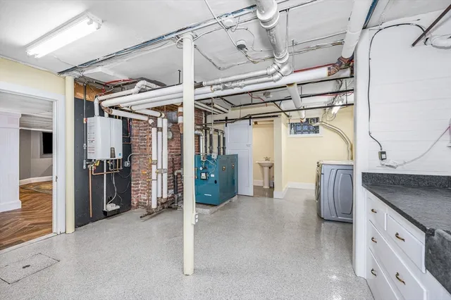 a kitchen with a refrigerator and a sink