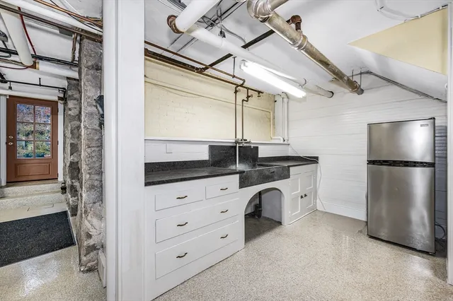 a bathroom with a sink and mirror